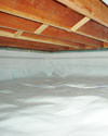 a moisture barrier installed on the walls and floors of a crawl space in West Ocean City