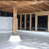 A large, encapsulated crawl space with our vapor barrier system installed in Lewes.