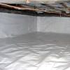 A crawl space vapor barrier has been installed on the walls and floors of this space in Rehoboth Beach.
