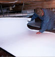 Lewes insulation being installed in a crawl space.