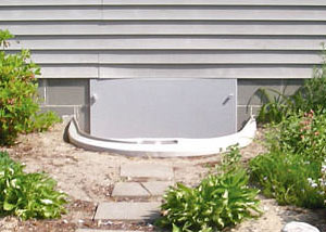Rigid plastic crawl space access well installed in a Central Kent crawl space