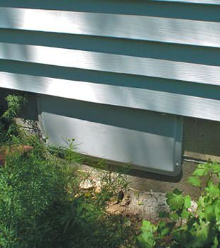 A gray crawl space vent cover in Camden